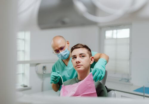 Boy getting a dental exam.