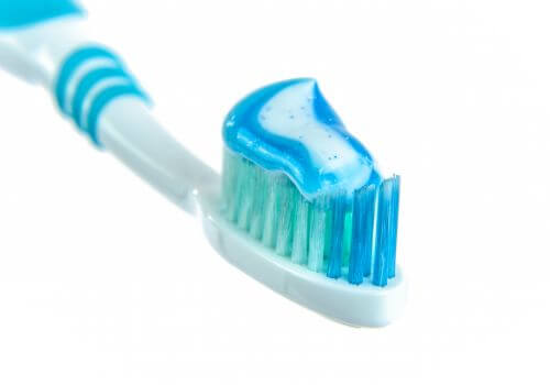 Flouride toothpaste on a toothbrush.