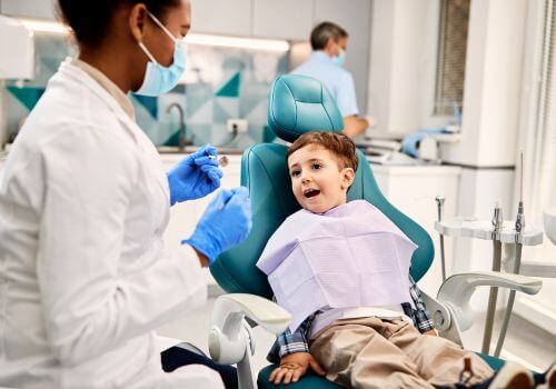 Young boy at the dentist for tooth pain
