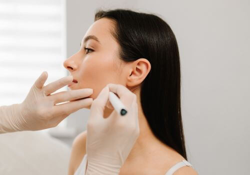 Woman getting Botox for TMJ.
