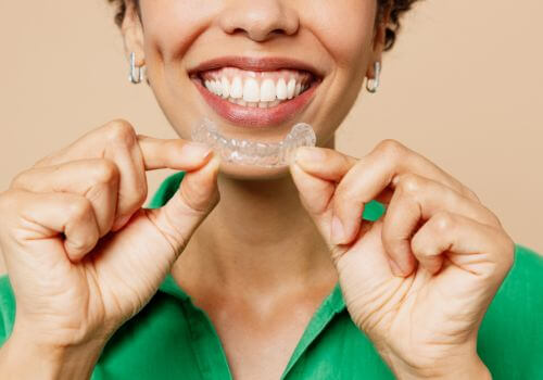 Woman with invisalign orthodontic treatment.