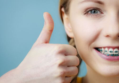 Girl smiling with braces.